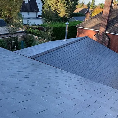 A man on a skateboard on top of a roof.