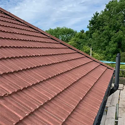 A man on a skateboard on the side of a building.