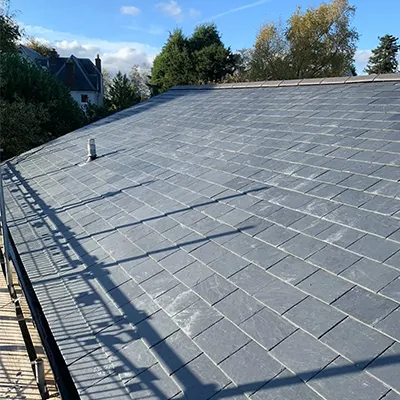 A person on a skateboard on a ramp.